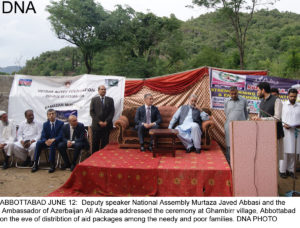ABBOTTABAD JUNE 12:  Deputy speaker National Assembly Murtaza Javed Abbasi and the  Ambassador of Azerbaijan Ali Alizada addressed the ceremony at Ghambirr village, Abbottabad on the eve of distribtion of aid packages among the needy and poor families. DNA PHOTO