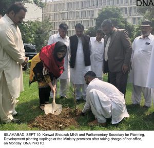 ISLAMABAD, SEPT 10: Kanwal Shauzab MNA and Parliamentary Secretary for Planning, Development planting saplings at the Ministry premises after taking charge of her office, on Monday. DNA PHOTO