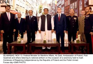 ISLAMABAD, NOV 13: Federal Minister for Maritime Affairs, Ali Zaidi, Ambassador of Poland, Piotr Opalinski and others listening to national anthem on the occasion of a ceremony held to mark Centenary of Regaining Independence by the Republic of Poland and the Polish Armed Forces day.=DNA PHOTO