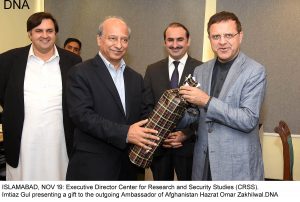 ISLAMABAD, NOV 19: Executive Director Center for Research and Security Studies (CRSS).  Imtiaz Gul presenting a gift to the outgoing Ambassador of Afghanistan Hazrat Omar Zakhilwal.DNA