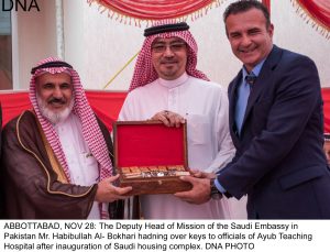 ABBOTTABAD, NOV 28: The Deputy Head of Mission of the Saudi Embassy in  Pakistan Mr. Habibullah Al- Bokhari hadning over keys to officials of Ayub Teaching Hospital after inauguration of Saudi housing complex. DNA PHOTO