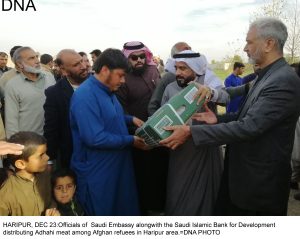 HARIPUR, DEC 23:Officials of  Saudi Embassy alongwith the Saudi Islamic Bank for Development  distributing Adhahi meat among Afghan refuees in Haripur area.=DNA PHOTO
