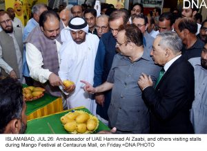 ISLAMABAD, JUL 26: Ambassador of UAE Hammad Al Zaabi, and others visiting stalls during Mango Festival at Centaurus Mall, on Friday.=DNA PHOTO