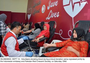 ISLAMABAD, SEPT 14: Volunteers donating blood during a blood donation camp orgnaised jointly by the Indonesian embassy and Pakistan Red Crescent Society, on Saturday. DNA