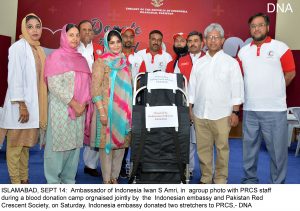 ISLAMABAD, SEPT 14: Ambassador of Indonesia Iwan S Amri, in agroup photo with PRCS staff during a blood donation camp orgnaised jointly by the Indonesian embassy and Pakistan Red Crescent Society, on Saturday. Indonesia embassy donated two stretchers to PRCS,- DNA