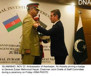 ISLAMABAD, NOV 22: Ambassador of Azerbaijan, Ali Alizada pinning a badge to General Zubair Mahmood Hayat, Chairman Joint Chiefs of Staff Committee during a ceremony on Friday.=DNA PHOTO