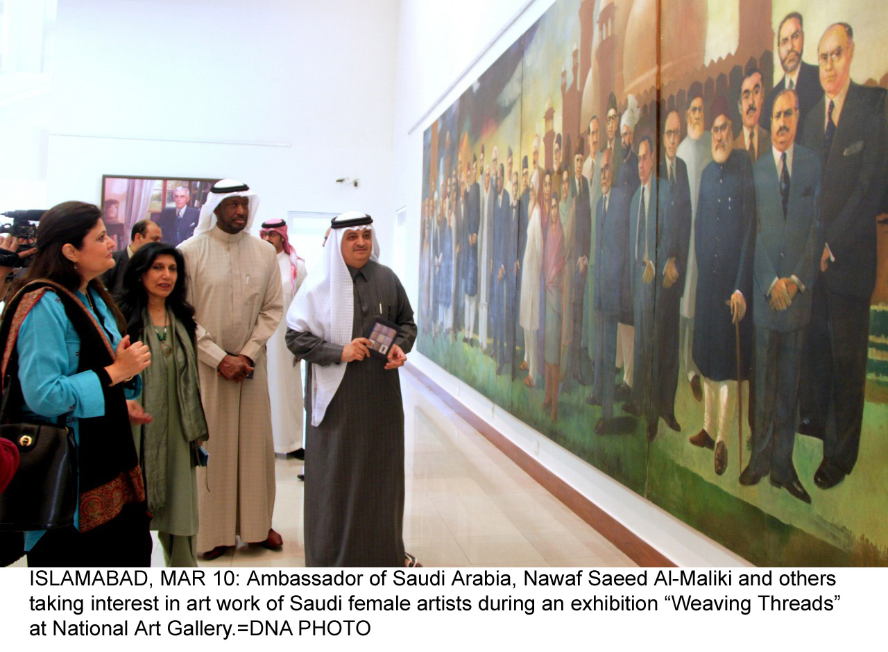 ISLAMABAD, MAR 10: Ambassador of Saudi Arabia, Nawaf Saeed Al-Maliki and others taking interest in art work of Saudi female artists during an exhibition Weaving Threads at National Art Gallery.=DNA PHOTO